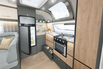 Light-flooded front kitchen that stretches across the entire width of the vehicle with full-cooker and large panoramic front skylight (depending on layout)