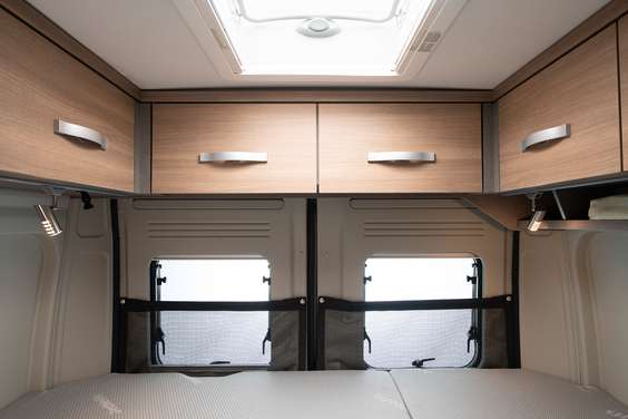 The standard overhead lockers above the rear door provide additional storage space.