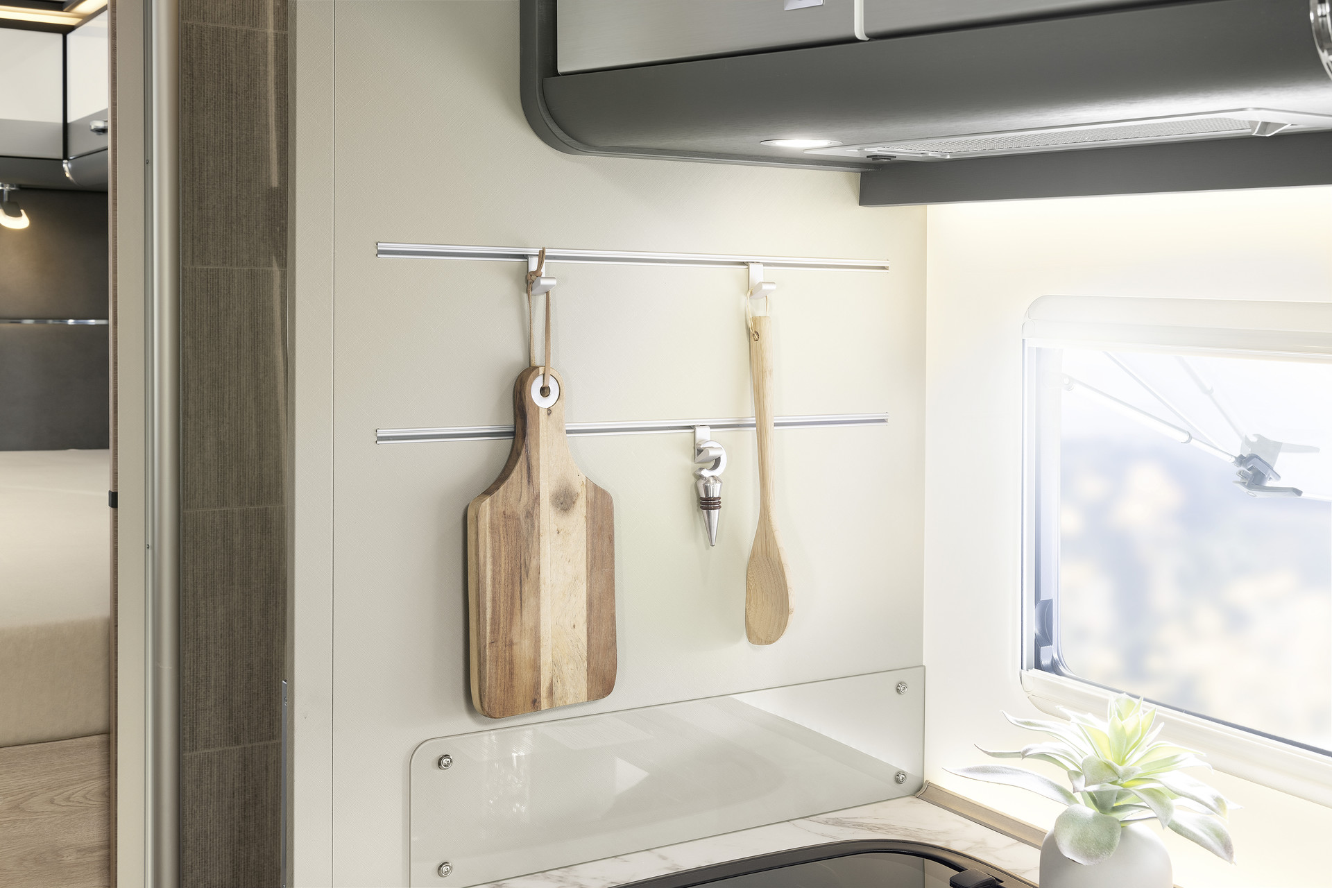 The kitchen boasts a range of practical and stylish solutions, such as the rail system.